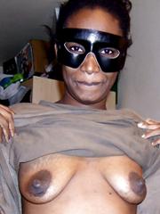 Black Ugly Boobs - Ugly black female wearing a mask bares his saggy boobs