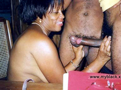 Black milf sucks two dick at once