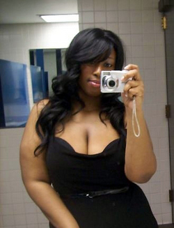 Busty black cutie with the fake huge